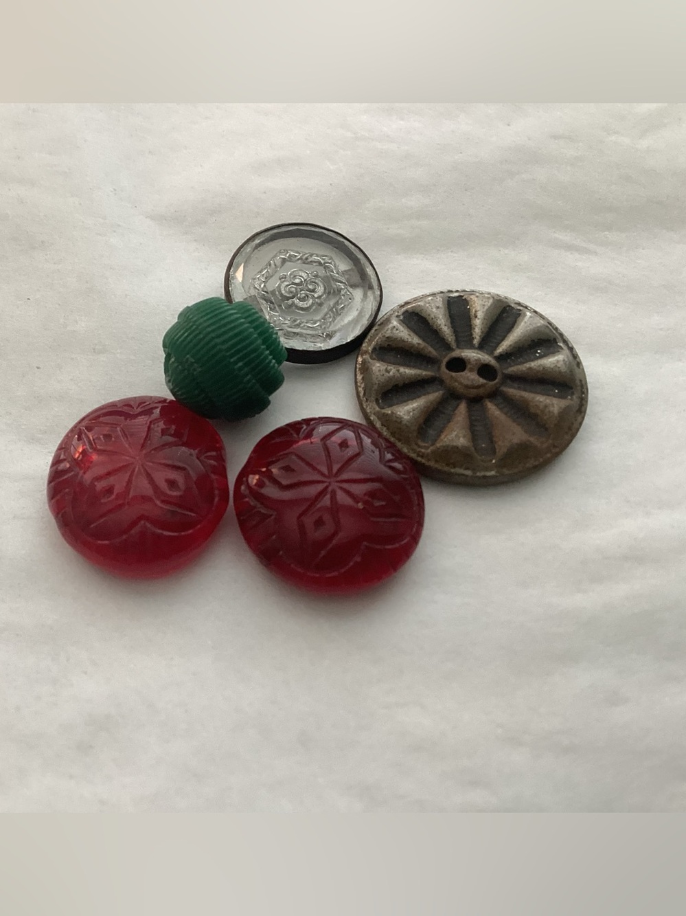 Antique assortment of buttons, metal floral motif, glass button, ruby? And more
